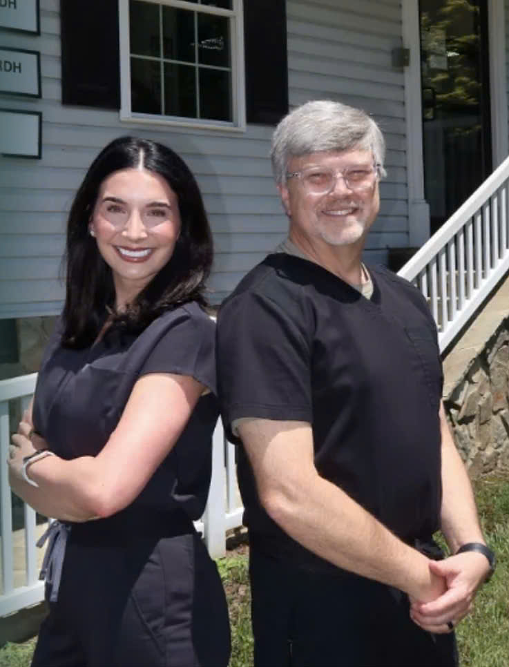 Dr. Logan Homesley and Dr. Wayne Hollar outside the Homesley Dental of Lenoir office.